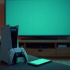 A PlayStation console and controller beside a TV with a phone on the couch, set up to join a Minecraft server