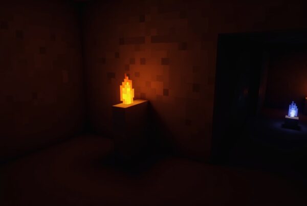 A Minecraft torch on a stone wall lighting a dark mine tunnel with coal ore nearby