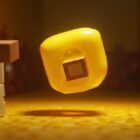 A translucent yellow sulfur cube with a block inside it, bouncing in a Minecraft sulfur cave